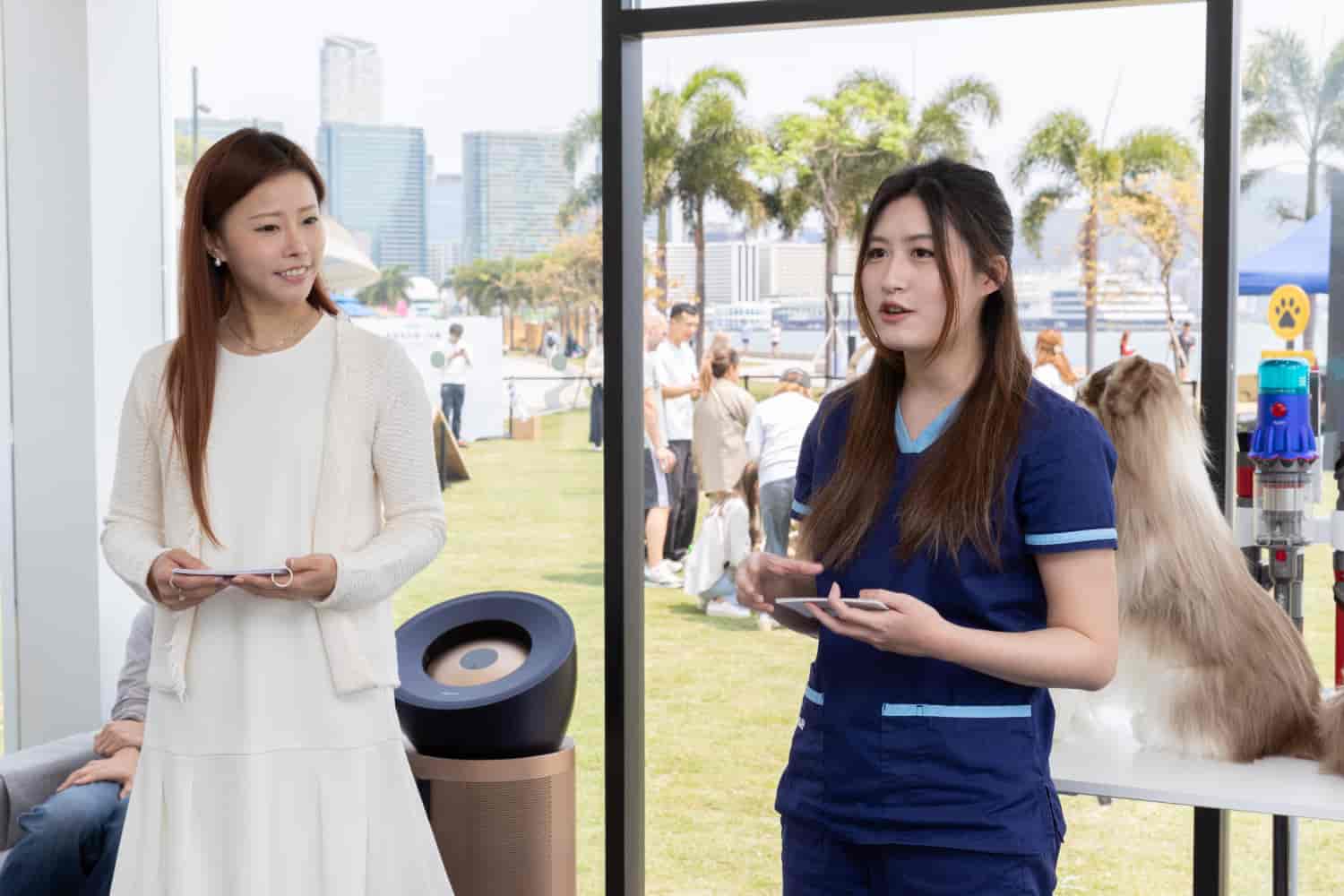 Dr Jasmine at an outdoor pet care event, discussing the impact of air quality on pet health